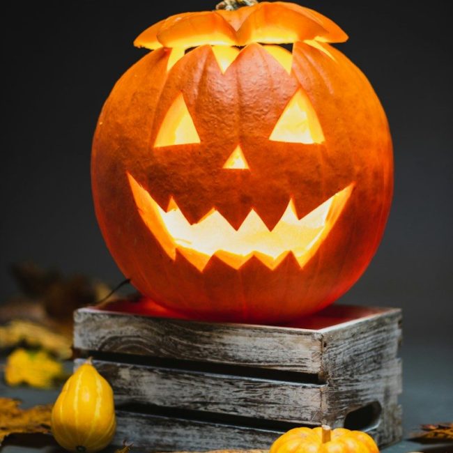 jack o lantern on brown wooden table
